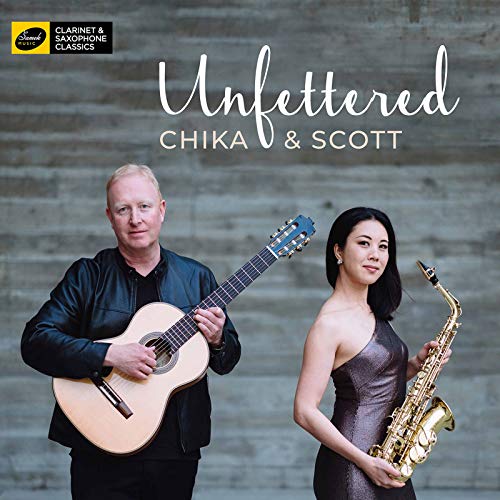 CD cover featuring a man with a guitar and a woman with a saxophone.
