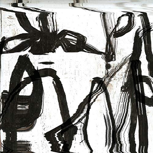 Black and white abstract brushstrokes on a vinyl record cover.