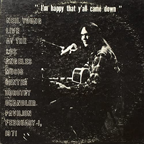 Neil Young album cover: black and white photo of Young with guitar.