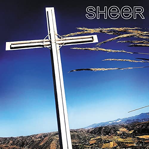 Album cover: a white cross against a blue sky and mountain landscape.