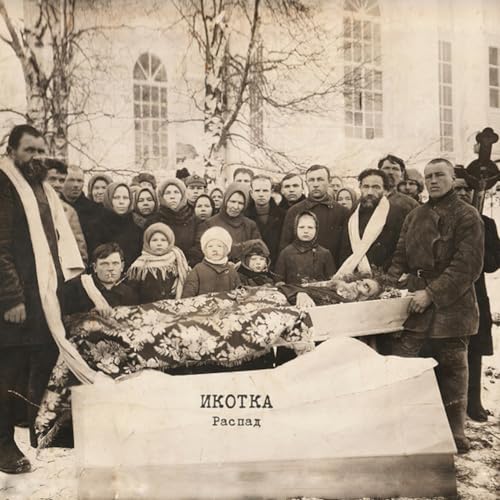 Black and white photo of a group with a coffin, snowy setting.
