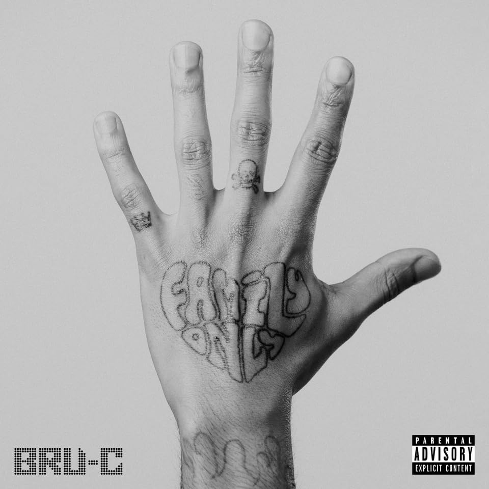 Black and white image of a hand with tattoos and the text "Family Only".