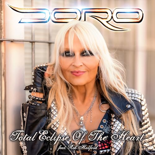 Doro Pesch with long blonde hair, wearing a studded leather jacket.
