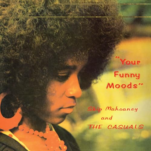 Album cover featuring a woman with an afro wearing large orange earrings and necklace.