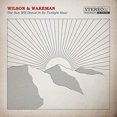Vinyl record cover with a sunburst and mountain range illustration.