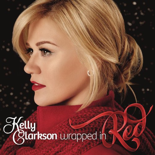Kelly Clarkson album cover, profile view, red sweater, and snowy background.