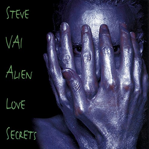 Silver-painted face with hands covering eyes, album cover art.