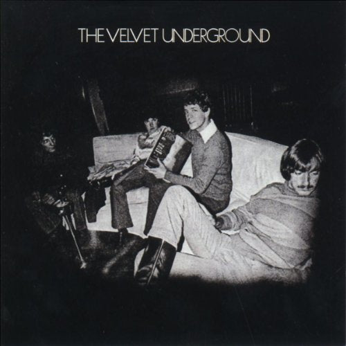 Black and white album cover featuring three people relaxing indoors.