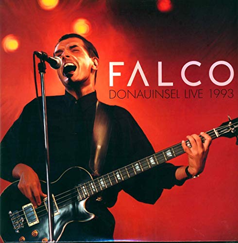 Falco performing live with a guitar and microphone, album cover.