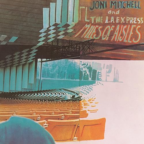 Joni Mitchell’s “Miles Of Aisles” album cover: concert hall seats and stage.