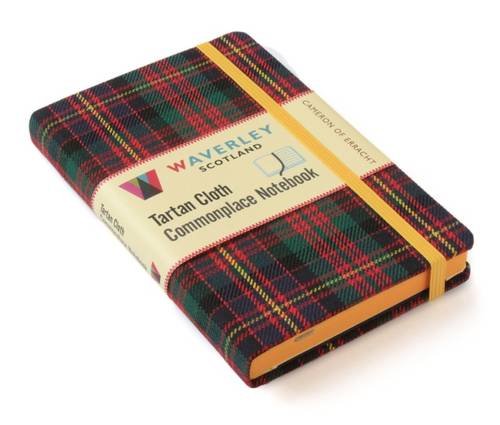 A notebook with a tartan cover featuring a traditional Scottish pattern and text.