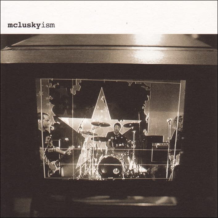 Black and white CD case for Mclusky's "Mcluskyism" with a band image.
