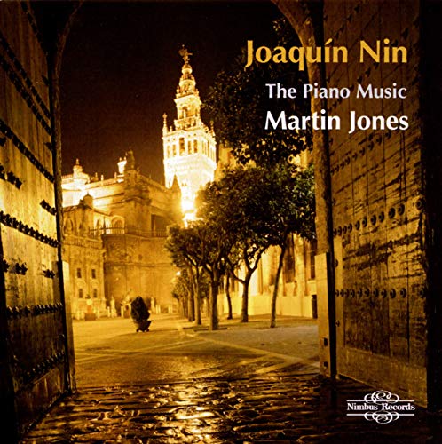 CD cover: illuminated cathedral viewed through an arched doorway at night.