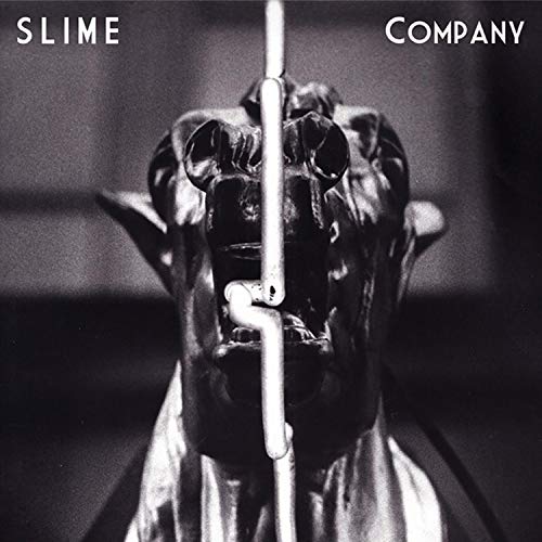 Black and white album cover featuring a distorted, metallic face.