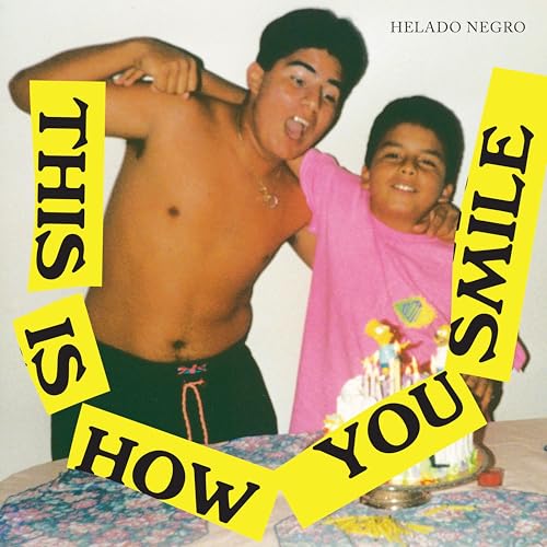 Album cover: two young boys with a birthday cake and yellow text.