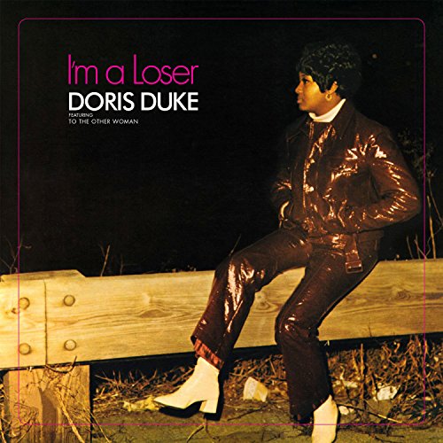 CD cover featuring Doris Duke in a shiny suit, sitting on wood.