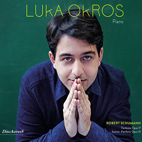 CD cover featuring pianist Luka Okros and text indicating Robert Schumann’s music.