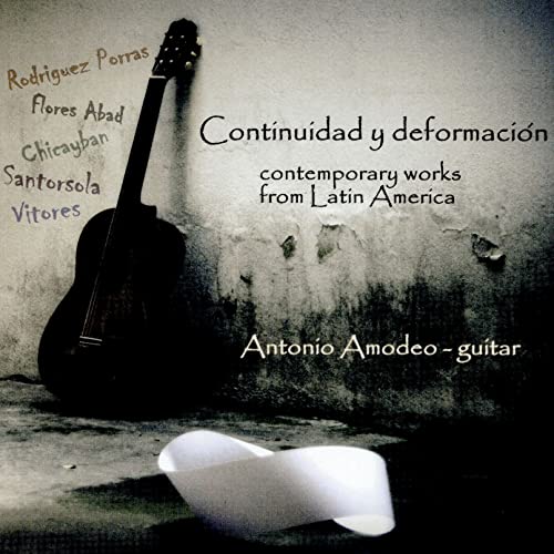 CD cover: guitar leaning against a textured wall, with text.