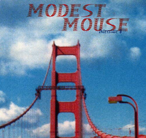 Modest Mouse album cover, featuring a red bridge against a blue sky.