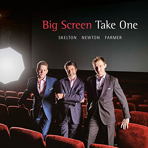 CD cover featuring three men in suits seated in a movie theater.