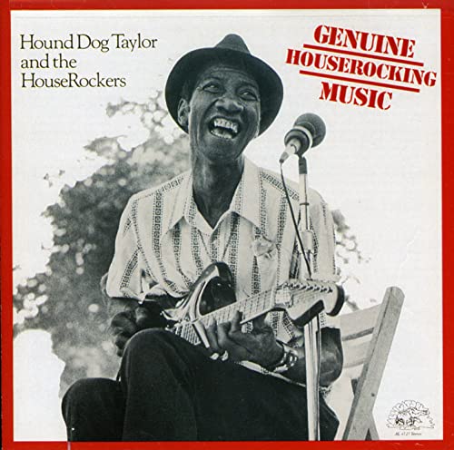 Hound Dog Taylor playing guitar and singing into a microphone.