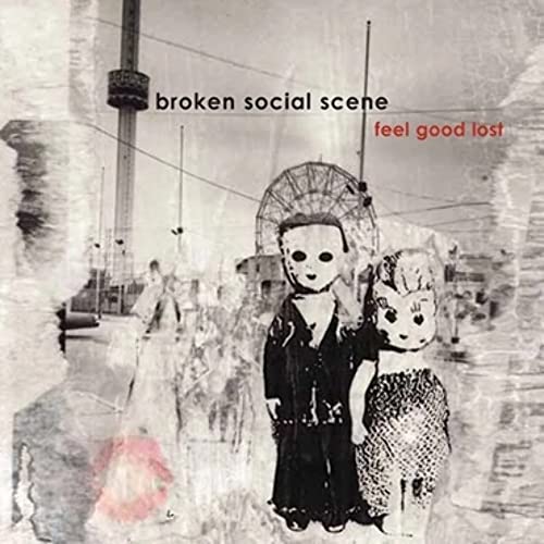 Broken Social Scene album cover with dolls and blurred cityscape.