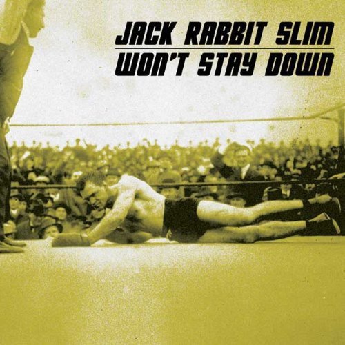 CD cover: boxing ring with a fallen fighter and crowd.