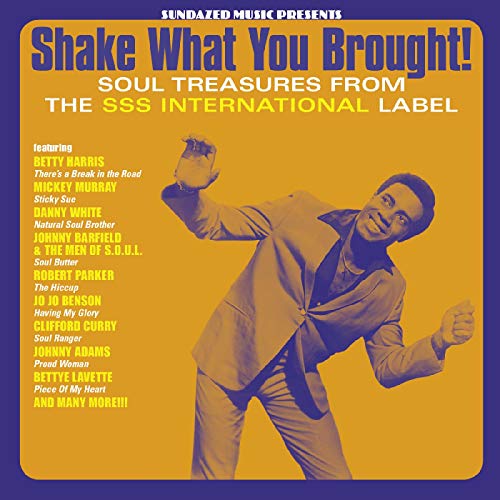Album cover: man in suit dancing, yellow background, bold text.