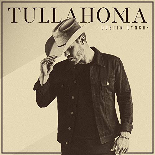 Dustin Lynch in a black jacket and cowboy hat, album cover.
