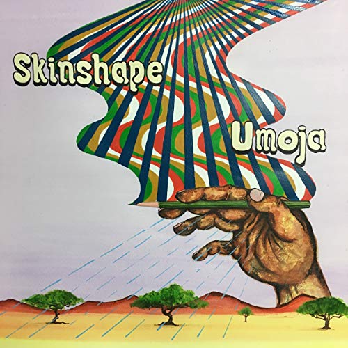 Vinyl record cover: hand holding rays over a desert landscape.