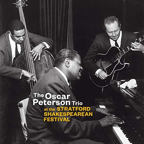 Black and white photo of Oscar Peterson Trio performing jazz music.