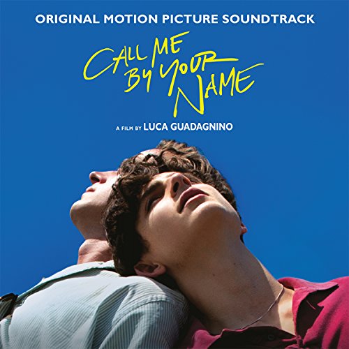 Two young men looking upward against a bright blue sky on the album cover.