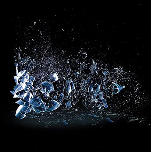 Black background with a burst of shattered, translucent blue glass fragments.