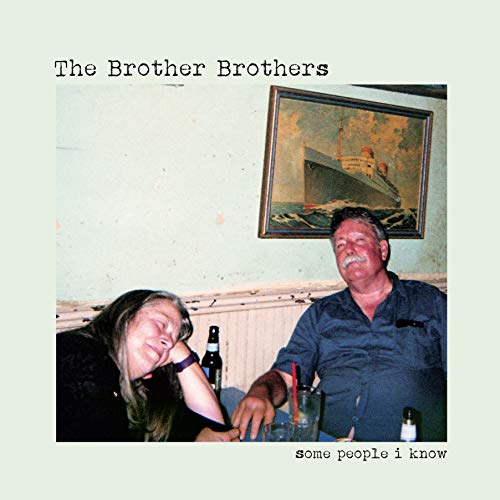 CD cover with a faded photo of two people and a painting.