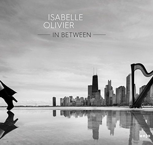 CD cover for Isabelle Olivier’s “In Between” featuring a city skyline.