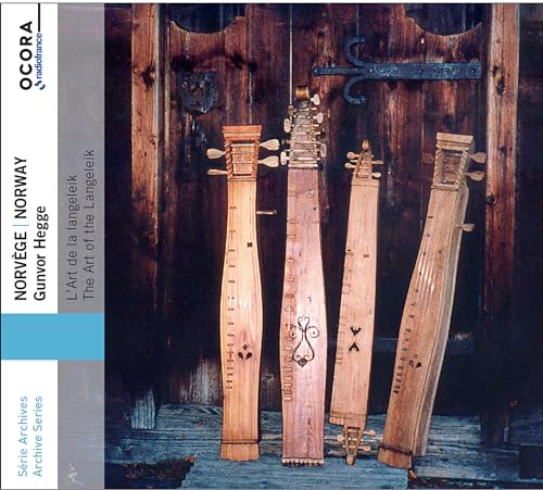 CD cover featuring four traditional Norwegian langeleik instruments against a wooden door.