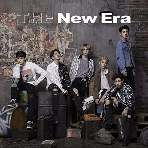 Got7 album cover featuring seven young men posing near vintage luggage.