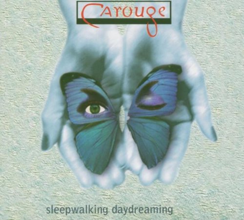 Hands holding butterfly wings with an eye, album cover art.