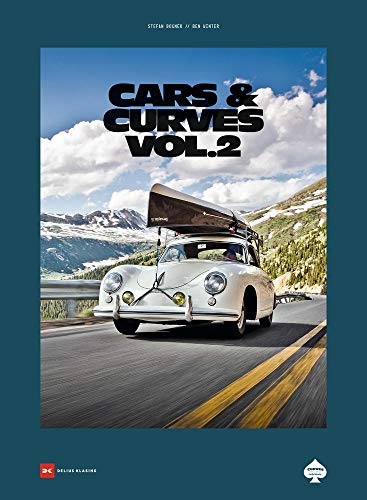 Vintage Porsche with luggage on roof driving on a winding mountain road.
