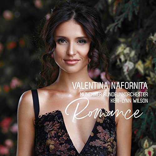 CD cover featuring a woman’s portrait with floral background and text.