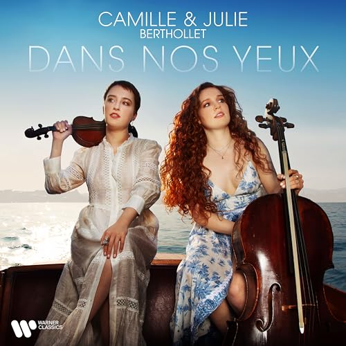 Two women with violin and cello, seaside background, album cover.