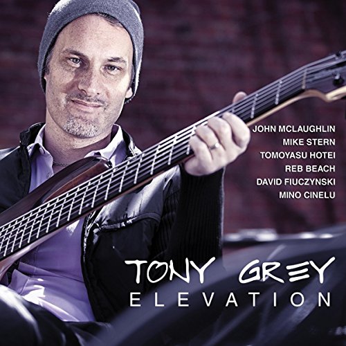 Tony Grey album cover featuring a man playing a bass guitar.