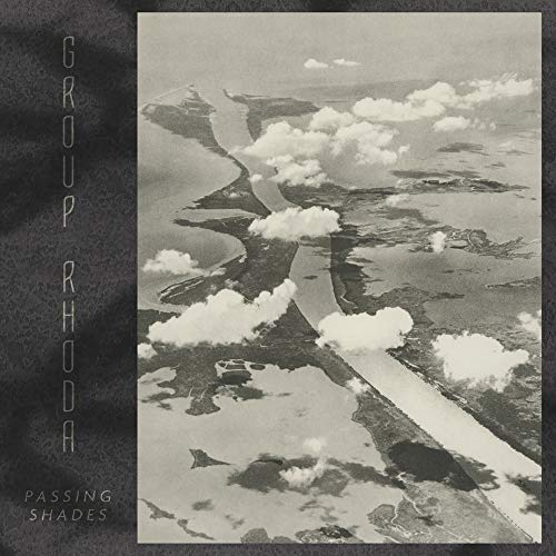 Vinyl album cover for Group Rhoda’s “Passing Shades” with aerial landscape.