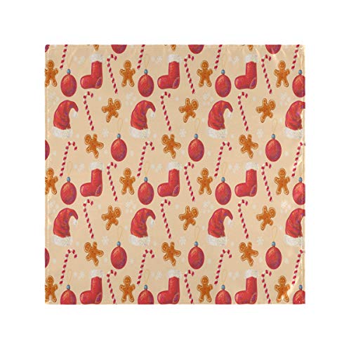 Pattern of Christmas stockings, candy canes, gingerbread men, and ornaments on beige background.
