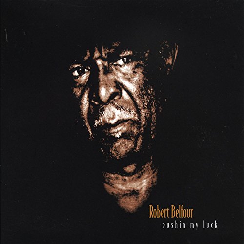 Close-up portrait of Robert Belfour on a dark album cover.