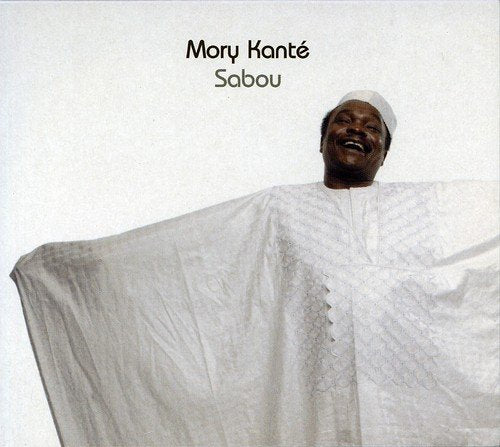 Mory Kante album cover, "Sabou," featuring a smiling man in white robes.