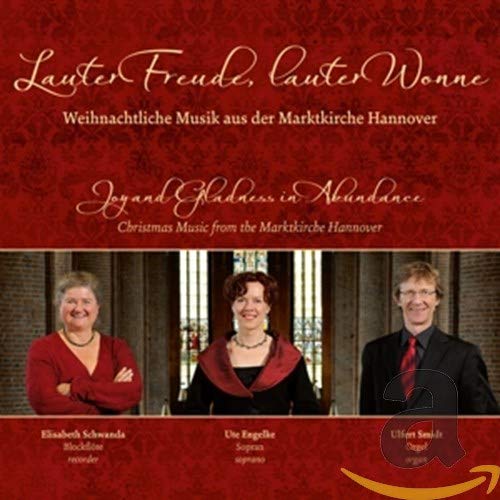 CD cover featuring three musicians and ornate text, Christmas music theme.