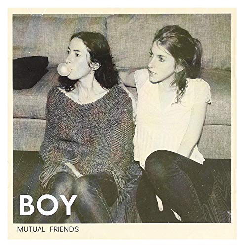 CD cover: two young women sitting close on a grey couch.