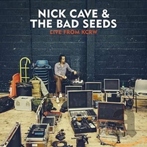 Nick Cave & The Bad Seeds album cover featuring a seated man and equipment.