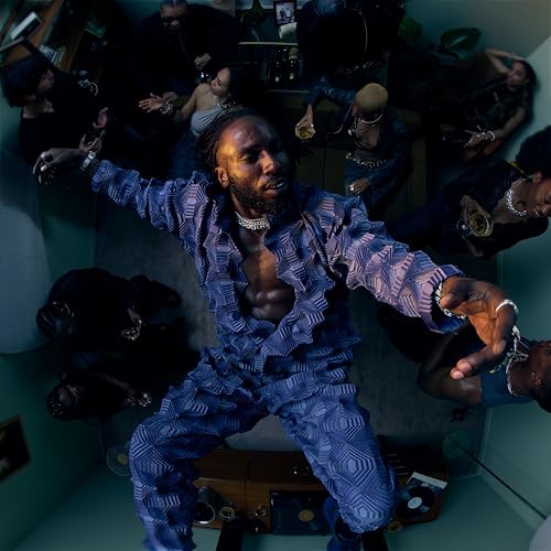 Kojey Radical album cover, featuring a man in blue patterned clothing.